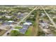 An elevated view shows the layout of neighborhood including roadways and surrounding properties at 488 Sunset N Rd, Rotonda West, FL 33947