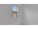 Minimalist bedroom with white walls and window view of the exterior at 488 Sunset N Rd, Rotonda West, FL 33947
