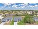 Attractive single Gathering homes feature well-manicured lawns, two car garages, and welcoming curb appeal at 488 Sunset N Rd, Rotonda West, FL 33947