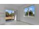 Bright room with sliding doors offering seamless access to the backyard, showcasing the indoor-outdoor living at 488 Sunset N Rd, Rotonda West, FL 33947