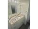 Bathroom vanity features a granite countertop and a modern sink at 6009 Sea Ranch Dr # 101, Hudson, FL 34667