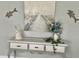 Elegant console table with stylish decor, adding a touch of sophistication to the space at 6009 Sea Ranch Dr # 101, Hudson, FL 34667