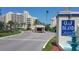 Gulf Island Beach & Tennis Club gated entrance with lush landscaping and a tranquil fountain feature at 6009 Sea Ranch Dr # 101, Hudson, FL 34667