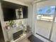 Living room features a large television with a view of the beach at 6009 Sea Ranch Dr # 101, Hudson, FL 34667