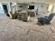 Relaxing lounge area featuring comfortable seating, a large TV, and stylish decor at 6009 Sea Ranch Dr # 101, Hudson, FL 34667