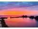 Beautiful sunset view reflecting on the water with vibrant orange, pink, and purple hues at 6009 Sea Ranch Dr # 101, Hudson, FL 34667