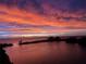 Beautiful sunset view over the water, with colorful clouds reflecting in the water at 6009 Sea Ranch Dr # 101, Hudson, FL 34667