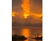 Panoramic sunset view over the water, creating a warm and inviting atmosphere at 6009 Sea Ranch Dr # 101, Hudson, FL 34667