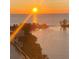 Stunning waterfront view featuring a vibrant sunset over the calm ocean water at 6009 Sea Ranch Dr # 101, Hudson, FL 34667