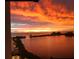 Breathtaking sunset featuring vivid orange skies over calm water with distant islands at 6009 Sea Ranch Dr # 101, Hudson, FL 34667