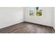 Well-lit bedroom with a view through two windows at 4160 Belladonna Ave, North Port, FL 34286