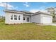 Charming single-story home with a two-car garage, landscaped yard and brick paver driveway at 4160 Belladonna Ave, North Port, FL 34286