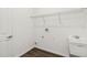 Laundry room with utility sink, door, wire shelving, and modern flooring at 4160 Belladonna Ave, North Port, FL 34286