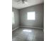 Bedroom with tiled floor and natural lighting at 15008 Spokane Rd, Spring Hill, FL 34610