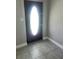 Tile entryway with an oval front door and neutral walls at 15008 Spokane Rd, Spring Hill, FL 34610