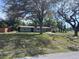 Charming single-story home with mature trees and a well-maintained lawn at 15008 Spokane Rd, Spring Hill, FL 34610