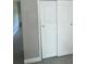 Hallway with closet and tile flooring leading to bedrooms at 15008 Spokane Rd, Spring Hill, FL 34610