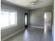Neutral Living Room with a ceiling fan and tiled floors at 15008 Spokane Rd, Spring Hill, FL 34610