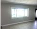 Bright living room with a large window and tile flooring at 15008 Spokane Rd, Spring Hill, FL 34610