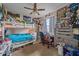 This bedroom features a bunk bed and ceiling fan at 18011 Prairie Wolf Gln, Parrish, FL 34219