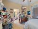 Functional bedroom with a dresser and TV, showcasing potential for personal touches at 18011 Prairie Wolf Gln, Parrish, FL 34219