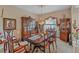 Formal dining room with antique furniture and elegant chandelier for upscale dinners at 18011 Prairie Wolf Gln, Parrish, FL 34219