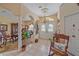 Inviting foyer with decorative chandelier and rocking chair at 18011 Prairie Wolf Gln, Parrish, FL 34219