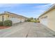 Spacious garages featuring a long driveway, enhanced by lush landscaping. Ample parking for multiple vehicles at 18011 Prairie Wolf Gln, Parrish, FL 34219