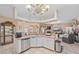 Spacious kitchen with white cabinets, stainless appliances, and open view to the living room at 18011 Prairie Wolf Gln, Parrish, FL 34219