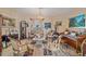Elegant living room featuring a piano, ornate decor, and classic furnishings at 18011 Prairie Wolf Gln, Parrish, FL 34219