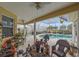 Outdoor patio with a pool and several chairs at 18011 Prairie Wolf Gln, Parrish, FL 34219