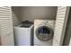 Convenient laundry closet with a washer and dryer at 1961 Whitney Way, Clearwater, FL 33760