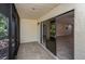 Enclosed patio with tiled floor and sliding glass doors leading to the interior of the home at 1961 Whitney Way, Clearwater, FL 33760