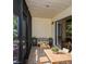 Outdoor patio features a dining table, seating area, and views of lush greenery at 1961 Whitney Way, Clearwater, FL 33760