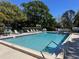 Relaxing community pool with lounge chairs at 1961 Whitney Way, Clearwater, FL 33760