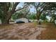 Wide backyard with mature trees and plenty of room to play at 2804 Robinson Rd, Plant City, FL 33565