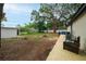 Backyard with wooden deck and an exterior shed, perfect for relaxation at 2804 Robinson Rd, Plant City, FL 33565
