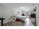 Bright bedroom featuring modern gray flooring and minimalist decor at 2804 Robinson Rd, Plant City, FL 33565