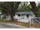 Charming home with a fenced yard and an inviting entrance at 2804 Robinson Rd, Plant City, FL 33565