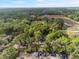 Aerial view of a beautiful home surrounded by lush greenery and natural landscape at 6005 Ike Smith Rd, Plant City, FL 33565