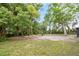 Green backyard with trees and small clearing at 6005 Ike Smith Rd, Plant City, FL 33565