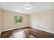 Bedroom with wood flooring, lots of natural light, and plenty of space at 6005 Ike Smith Rd, Plant City, FL 33565