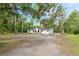 Charming single-story home featuring a well-maintained lawn and a spacious driveway at 6005 Ike Smith Rd, Plant City, FL 33565