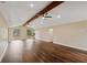 Bright living room features hardwood floors, ceiling fans and ample space for relaxation and entertainment at 6005 Ike Smith Rd, Plant City, FL 33565