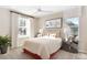 Comfortable bedroom with a cozy bed, bright windows, stylish decor, and bedside tables with lamps at 6014 Jensen View Ave, Apollo Beach, FL 33572