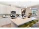 Bright kitchen with pendant lighting, a large island, stainless steel appliances and bar stool seating at 6014 Jensen View Ave, Apollo Beach, FL 33572