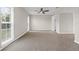 Bright bedroom with carpet floors, natural light, ceiling fan and neutral walls at 14010 102Nd Ave, Largo, FL 33774