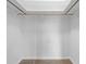 A simple, walk-in closet featuring carpet floors and a functional storage system at 14010 102Nd Ave, Largo, FL 33774
