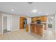 Kitchen features stainless steel appliances, wood cabinets, tile floors and peninsula island with granite countertop at 14010 102Nd Ave, Largo, FL 33774