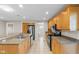 A spacious kitchen featuring stainless steel appliances and light wood cabinets at 14010 102Nd Ave, Largo, FL 33774